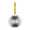 Cream frying pan with gold handle, base facing up, Salter branding visible