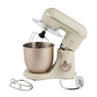 Cream stand mixer with metal mixing bowl and attachments, shown on white background
