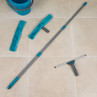 Window cleaning kit with blue bucket, telescopic pole, squeegee, and two microfibre pads.