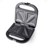 Black sandwich maker with four triangle slots, open to show non-stick plates