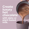 Promotional image: hot chocolate pouring into a mug with dairy or plant-based milk