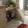Bathroom cabinet open showing gold and black analogue bathroom scales and towels