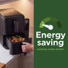 Black air fryer with pull-out basket and energy saving message