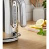 Chrome electric kettle with side water level indicator on kitchen worktop