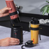 Salter personal blender with smoothie cup and spare yellow drink bottle on kitchen counter