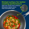Non-stick wok with silver etched surface, shown cooking a colourful stir fry.