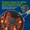 Non-stick silver frying pan with etched surface and cooked stew, highlighting sear and release zones