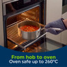 Silver saucepan with tomato-based stew in oven, oven safe up to 260°C.