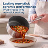Stainless steel saucepan with ceramic non-stick coating, pouring vegetable soup into a bowl