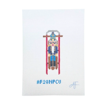 Sled with Purple Nutcracker 4.25"H x 2"W 14 Mesh AF28NCPU  Anne Fisher Needlepoint, llc
