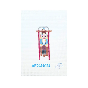 Sled with Blue Nutcracker 4.25"H x 2"W 14 Mesh AF28NCBL Anne Fisher Needlepoint, llc