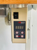 Side view of Juki DDL-8100e industrial sewing machine showing low vibration design and motor setup