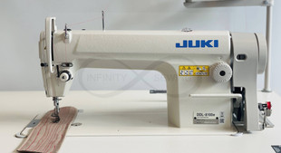 Fully assembled Juki DDL-8100e Industrial Sewing Machine on a sturdy unit stand, ready for professional sewing use Fully assembled Juki DDL-8100e Industrial Sewing Machine on a sturdy unit stand, ready for professional sewing use