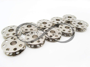 Metal bobbins, uniquely designed for Singer featherweight machines, ensuring optimal thread tension and performance.