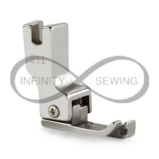 Compensating Presser Foot, designed for industrial sewing machines. Engineered with meticulous attention to detail, this foot ensures uniform stitching along the fabric's edge. Compensating Presser Foot, designed for industrial sewing machines. Engineered with meticulous attention to detail, this foot ensures uniform stitching along the fabric's edge.