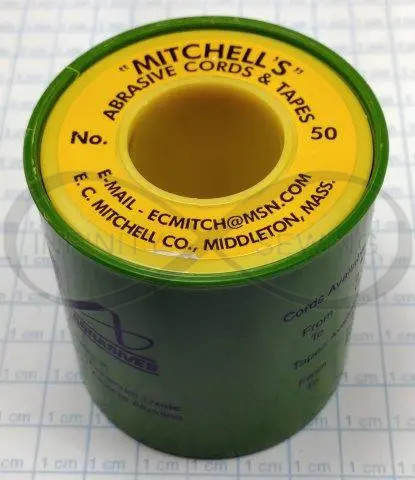 Mitchell's 50 Abrasive Cord. This aluminum oxide cord, Ø1.78mm, is supplied on a 15-meter spool with a grain of 180, perfect for sanding and cleaning hard-to-reach areas in intricate inlay and marquetry designs.