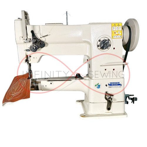 Close-up of Wimsew W-246 sewing leather material with walking foot mechanism. Close-up of Wimsew W-246 sewing leather material with walking foot mechanism.