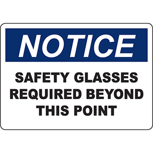 Notice sign indicating that safety glasses are required beyond this point for workplace safety compliance.