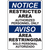Notice restricted area bilingual sign emphasizing authorized personnel only for safety and compliance in industrial settings.