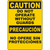 Yellow bilingual caution sign advising against operation without guards for enhanced safety in industrial settings.