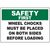 Safety first sign instructing to place wheel chocks on both sides before loading for industrial safety compliance.
