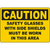 Caution sign instructing safety glasses with side shields must be worn in this area for workplace safety.