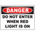 Warning sign: Do not enter when red light is on, vital for industrial safety and compliance in workplace environments.