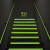 Glow-in-the-dark floor safety tape marking a stairway exit, enhancing visibility for safer navigation in low light.