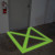 Glow-in-the-dark floor safety tape marking a doorway for enhanced visibility and safety in industrial environments.