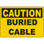 Yellow caution sign warning of buried cable hazards for safe industrial labeling solutions.