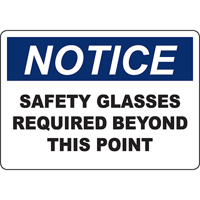 Notice sign indicating that safety glasses are required beyond this point for workplace safety compliance.
