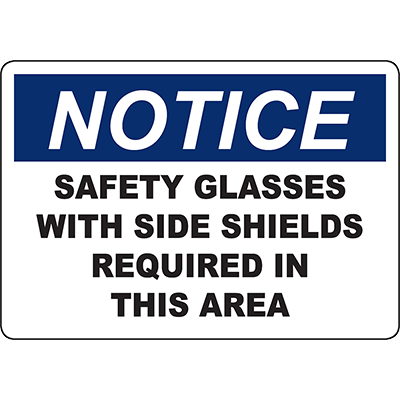 Notice sign requiring safety glasses with side shields in this area for workplace safety compliance.