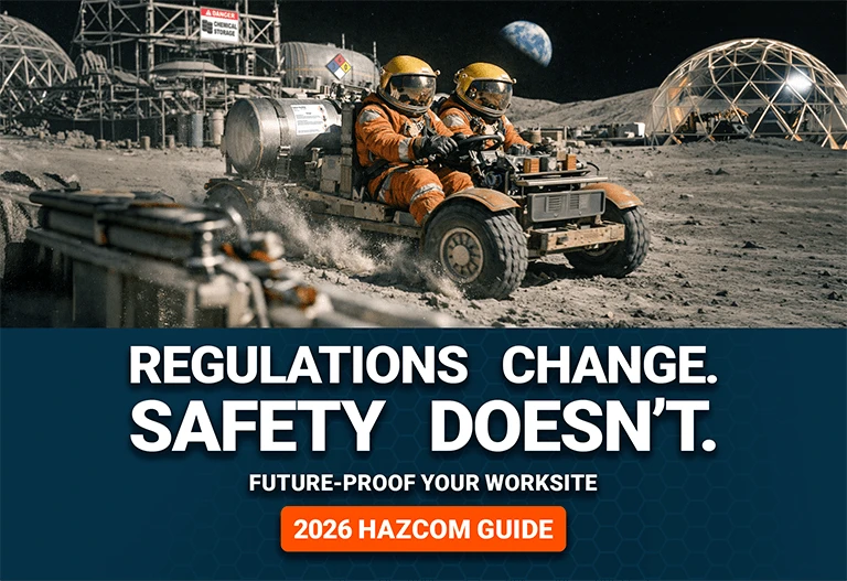 Two astronauts drive a rugged rover across a moon-like industrial worksite, with domed structures and Earth in the background. Large text reads: “Regulations change. Safety doesn’t. Future-proof your worksite. 2026 HazCom Guide.”