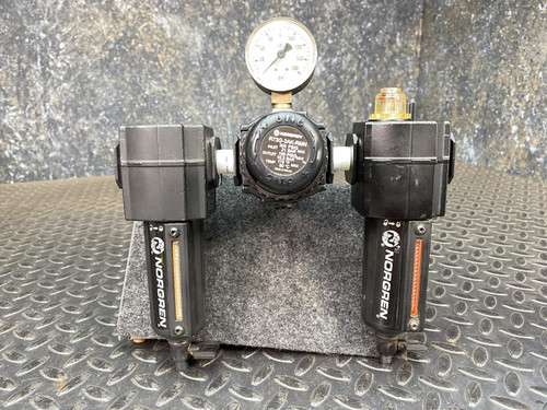 Norgren FRL assembly showing R73G-3AK-RMN label details, attached 160 PSI gauge, and minor cosmetic wear.