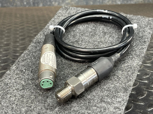 Druck PDCR 810 transducer with black coiled cable, threaded sensor end, and circular 4-pin connector.