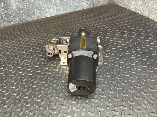 Swagelok 135 SR 90° spring return actuator, black housing, visible mounting bracket and valve connection.