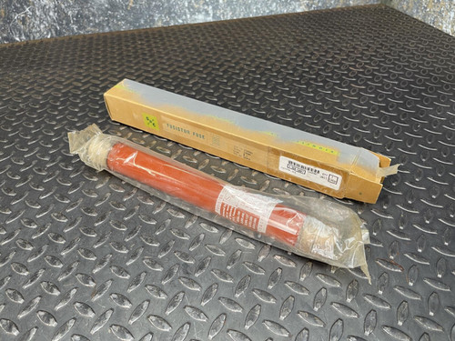 S&C Electric 272000 15 kV Fusistor fuse unit in original packaging on a diamond plate surface.