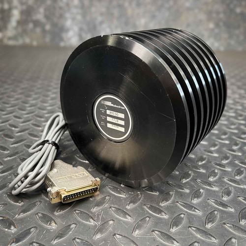 A Molectron / Coherent PM150 Thermopile Laser Power Sensor, aircooled, is shown in a threequarter view, resting on a textured metallic diamond plate surface. The laser power meter features a distinctive black, finned cylindrical design, indicative of its thermopile and aircooled properties for efficient heat dissipation. A label on the circular end prominently displays "Molectron" and "PM150" along with a serial number "7709". A coiled gray cable with a goldcolored 25pin Dsub (DB25 male) connector extends from the optical sensor, ready for connection. This industrial or lab equipment is a crucial tool for precise laser measurement.