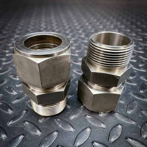 2-Pack Swagelok Stainless Steel Connectors SS-2000-1-24, unused, showing bright threads and hex bodies on diamond plate.