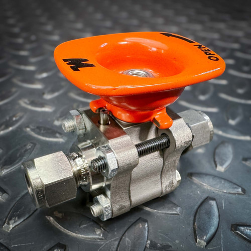 Whitey Swagelok SS-62TS6-KS 3/8 inch stainless steel ball valve with orange handle and Swagelok fittings.