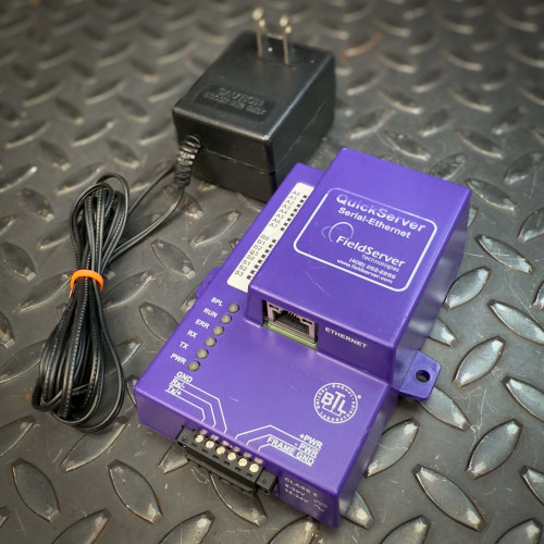 Field Technologies QuickServer FS-QS-1210-0309 Serial-Ethernet Gateway from Obtainium Science and Surplus shown in purple casing with an Ethernet port and terminal block, placed on a textured metal surface next to its black power adapter. Field Technologies QuickServer FS-QS-1210-0309 Serial-Ethernet Gateway from Obtainium Science and Surplus shown in purple casing with an Ethernet port and terminal block, placed on a textured metal surface next to its black power adapter.
