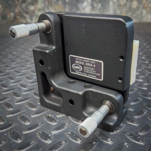 Front angled view of the Newport 600A-4 Kinematic 4" Precision Universal Optical Mount from Obtainium Science and Surplus, showing two micrometers for precision adjustment and the label plate.