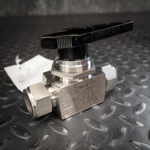Swagelok SS-45S12 stainless steel ball valve with black handle and 3/4 inch end connections.