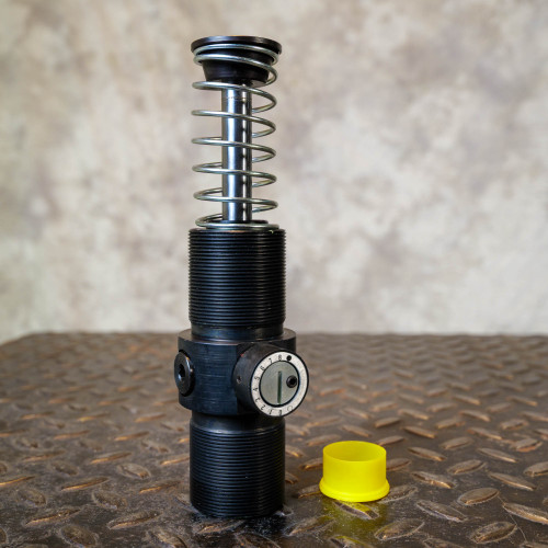 Enidine shock absorber showing external threads intact, adjustment dial 1-8 clear, piston rod clean and bright.