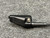 Side of the radio plug with its thumbscrew and ribbed cord strain relief