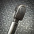 Side of the torque wrench head with a round cap and pivot joint