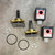 Two complete valve assemblies and hardware showing unused condition. Solenoid coils labeled Parker 2381280110.