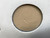 Close view of the tan transducer face showing marks on its surface