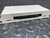 A National Instruments NI SCXI-1302, 50-Pin Terminal Block from Obtainium Science and Surplus, showing a detailed view of its connector. The device is on a textured metal surface.