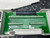 A close-up of the internal green circuit board and connections of a National Instruments NI SCXI-1302, 50-Pin Terminal Block from Obtainium Science and Surplus. The device is on a textured metal surface.